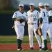Eastern baseball players smile as they chat while waiting for their pitcher to warm up as Eastern takes on Michigan State at Oestrike Stadium on Wednesday.  Melanie Maxwell I AnnArbor.com